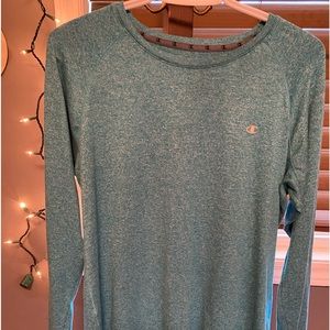 A champion shirt, in an XL. Green in colour. Comes with thumb holes.